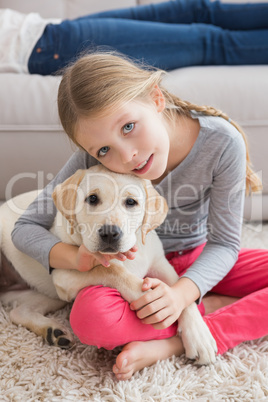 Happy little girl with her puppy