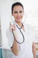 Doctor using a stethoscope at work
