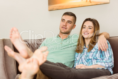 Cute couple relaxing on couch