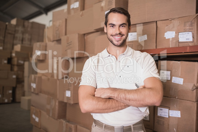 Confident worker smiling in warehouse