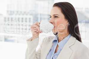 Woman drinking from a cup