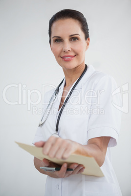 Smiling doctor looking at camera