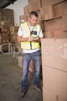 Warehouse worker with clipboard