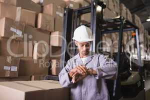 Warehouse worker checking time