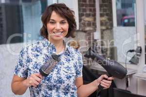 Confident hairdresser smiling at camera