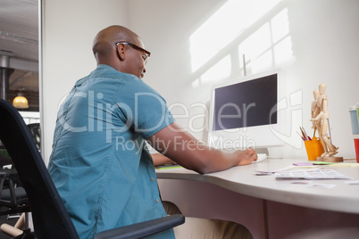 Casual businessman working at his desk