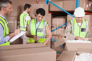 People at work in warehouse