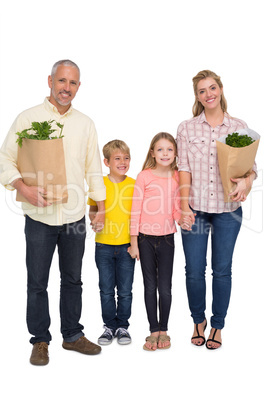 Happy family with grocery bags