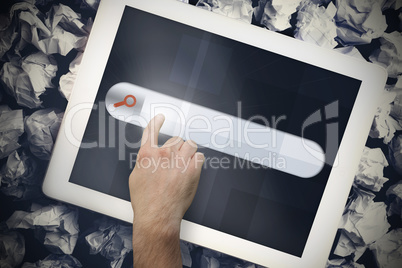 Hands touching search bar on tablet screen