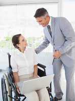 Disabled business woman working with partner