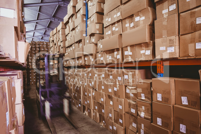 Forklift in large warehouse