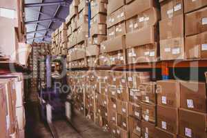 Forklift in large warehouse