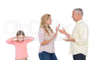 Parents arguing beside their upset daughter