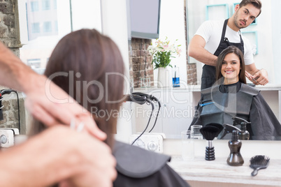 Pretty brunette getting her hair cut