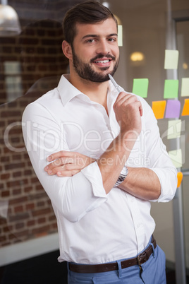 Casual businessman smiling at camera