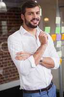 Casual businessman smiling at camera