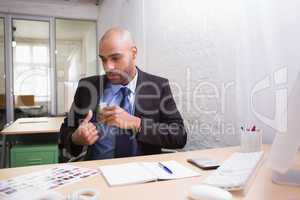 Businessman sitting at office desk
