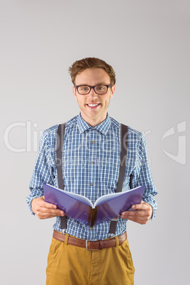 Geeky student reading a book Geeky student reading a book