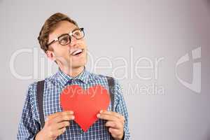 Geeky hipster holding a heart card