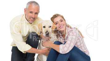 Happy couple with their pet dog