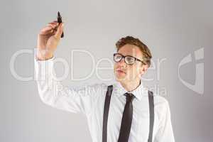 Geeky businessman writing with marker