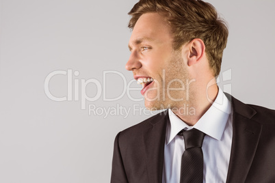 Young handsome businessman looking away