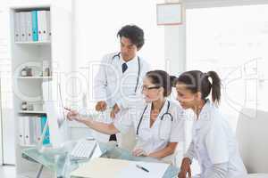 Hard working doctors reviewing notes