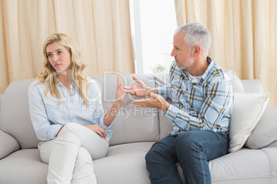 Couple arguing on the couch