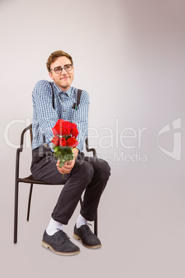 Geeky hipster holding a bunch of roses