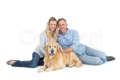 Portrait of smiling couple sitting together with their dog