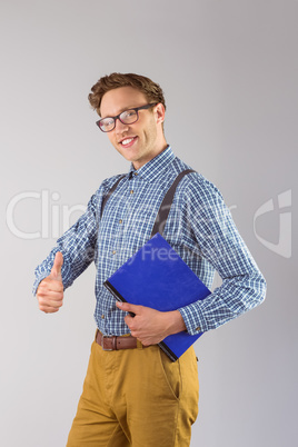 Geeky student holding a notebook