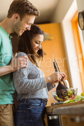 Cute couple making a salad