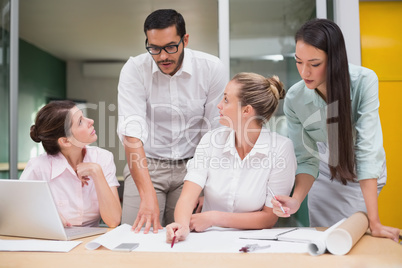 Architecture team working together at desk