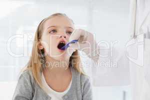 Doctor checking patients tonsils
