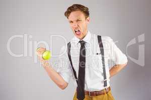 Geeky businessman lifting a dumbbell