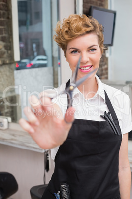 Confident hairdresser smiling at camera