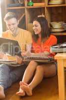 Young couple looking at vinyl collection