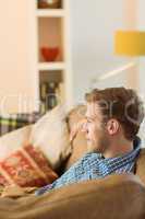 Young man relaxing on his couch