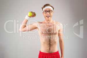 Geeky shirtless hipster posing with dumbbell