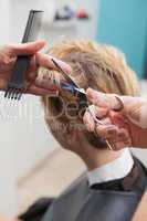 Hairdresser cutting a customers hair