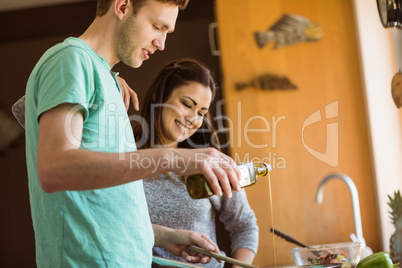 Cute couple preparing food together