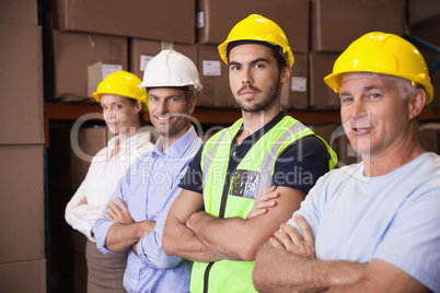 Warehouse team smiling at camera