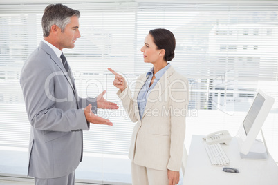 Businesswoman arguing with co worker