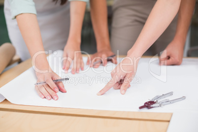 Architecture team working together at desk