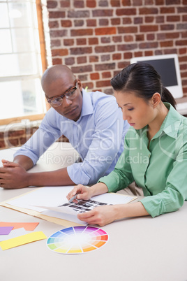 Casual business team working together at desk