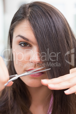 Pretty brunette getting her hair cut