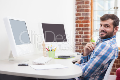 Casual businessman working at his desk