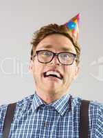 Geeky hipster wearing party hat