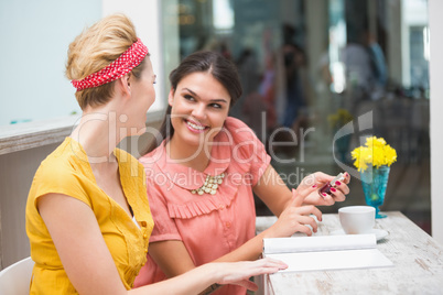 Pretty friends having a coffee