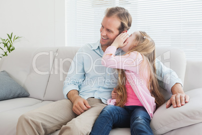 Casual father and daughter on the couch